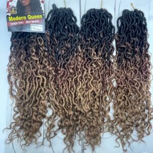 Display of multiple curly hair extension bundles in black-to-brown ombre, hanging on a wall with a