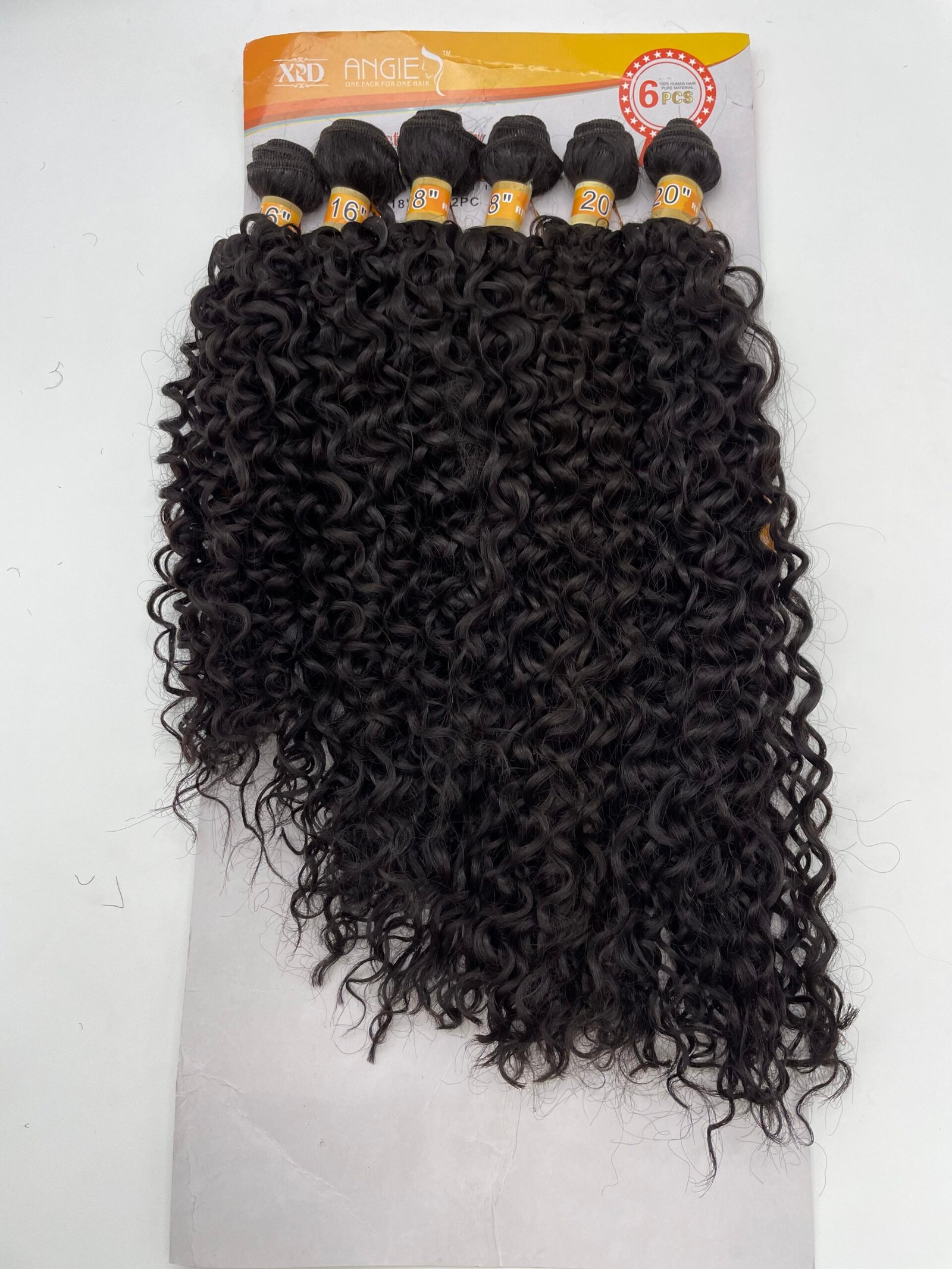 Six bundles of black, tight-curly hair extensions attached to an orange display card labeled '6 pcs'.