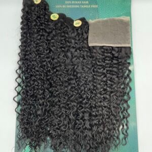 Curly black hair extensions laid on a teal display card, showing long, tight curls and wefts.