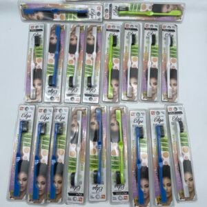 Multiple blister-packaged toothbrushes laid out in a grid, with blue, green, and pink handle colors visible.