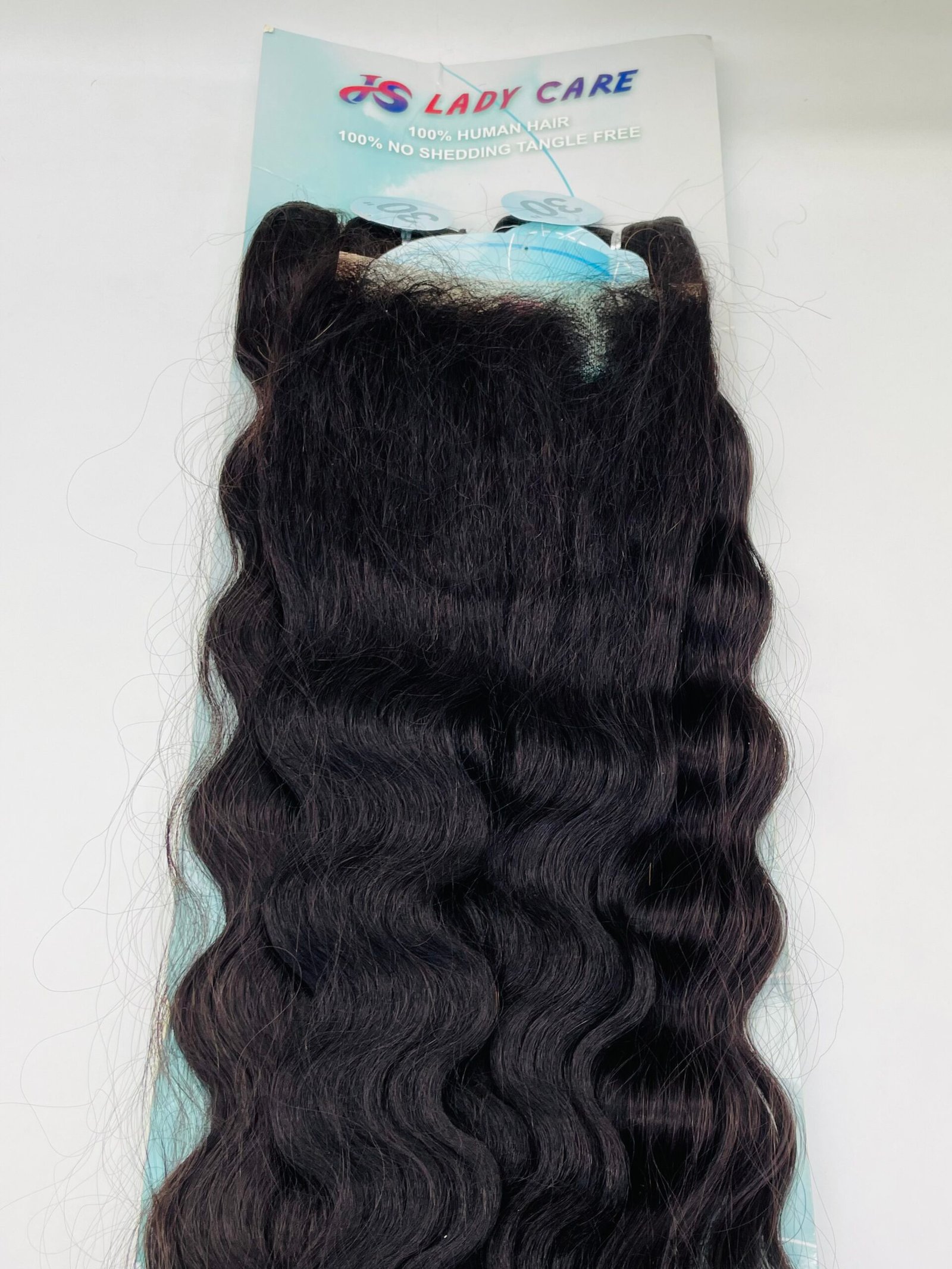 Long black, wavy hair extensions attached to a light blue display card with the brand name 'Lady Care' visible at the top.