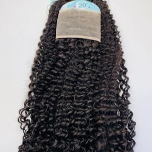 Back view of a long, dark brown curly wig on a display card with a beige mesh cap, set against a light background.