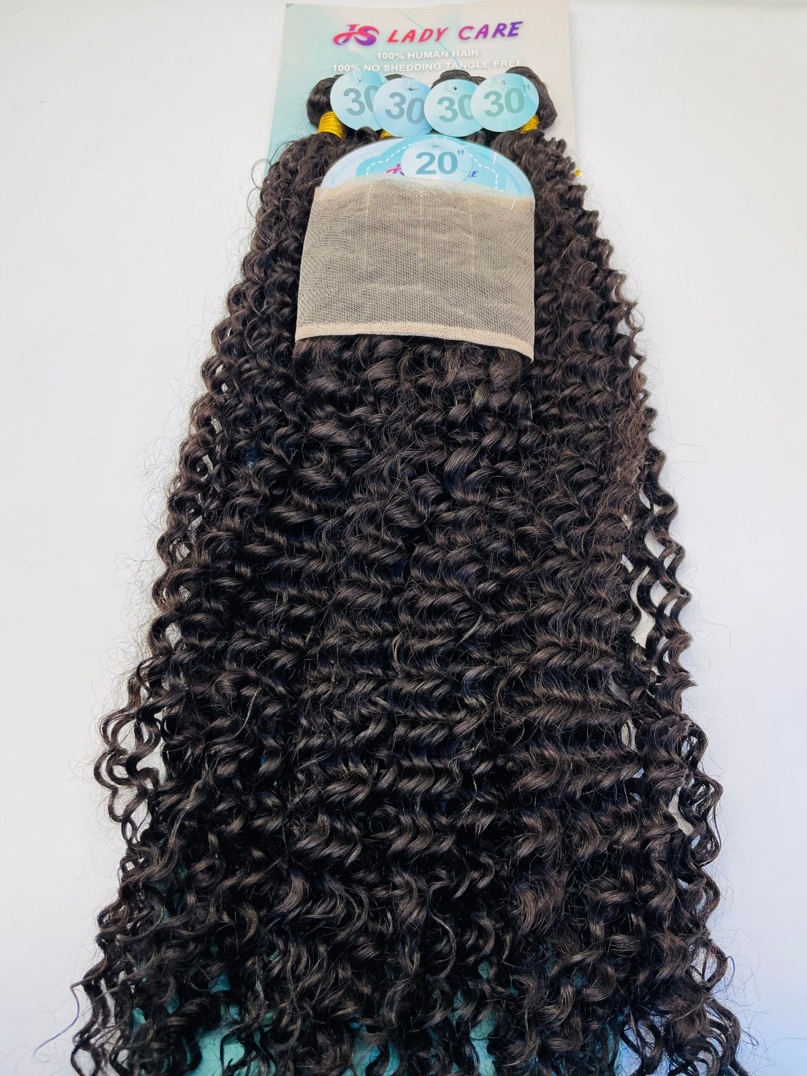 Back view of a long, dark brown curly wig on a display card with a beige mesh cap, set against a light background.