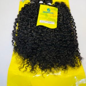 Bundle of tight, curly black hair extensions laid over a bright yellow Goodear packaging card.