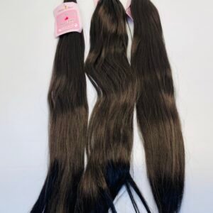 Three long dark-brown hair extensions with a pink product tag attached at the top.