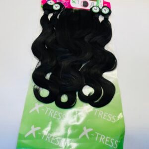 Four black hair extension wefts with green labels laid on a lime green X-TRESS packaging, displaying wavy strands ready for sale or use.