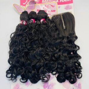 Curly black hair extensions laid over a pink Meisha Hair display card on a flower-patterned surface, viewed from above, showing texture and curl definition.