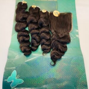 Dark brown hair extensions in loose bundles laid on a blue-green patterned backing with butterfly graphics.