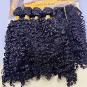 Curly black hair extensions in bundles on a yellow iDOLLA Luxury Hair packaging card.