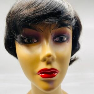 Mannequin head with a short black bob wig and bold purple eye makeup and red lips.