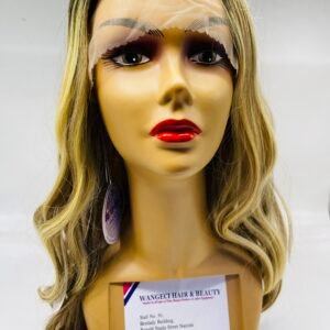 Mannequin head with long blond hair, bold red lips, and a lace eye mask, with a display tag in front.