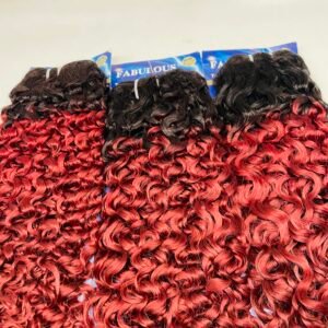 Bundles of curly red-to-black ombre hair extensions on display, arranged in a row