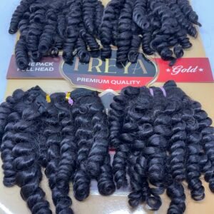 Curly black hair extensions in bundles on a display card that reads Freya Gold Premium Quality, 16-inch length.