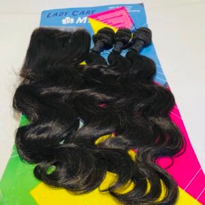 Bundles of long black wavy hair laid on a bright geometric background with yellow, green, and pink shapes (hair extensions on product packaging).